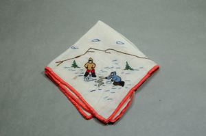 Image of Two figures ice fishing, one of a set of 4 embroidered napkins, each with different outdoor activity 
